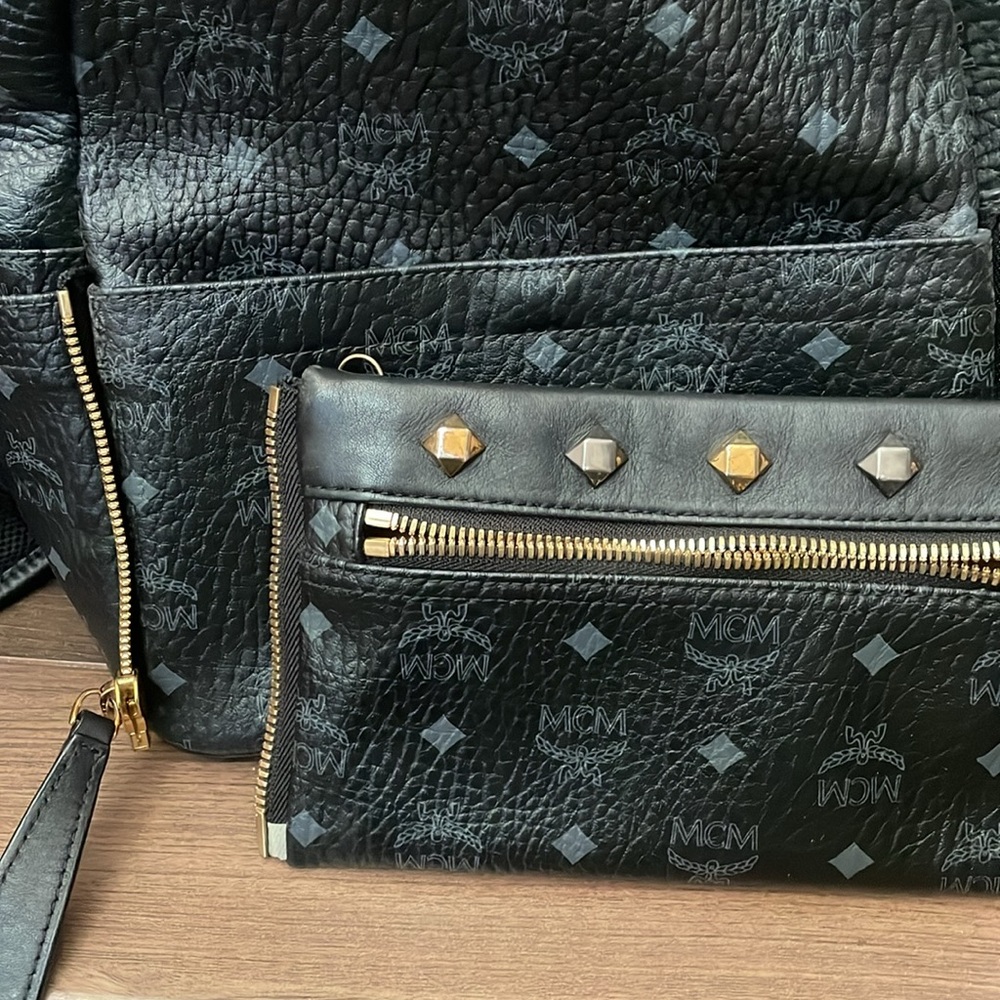 MCM Black Leather Backpack with Gold Accents